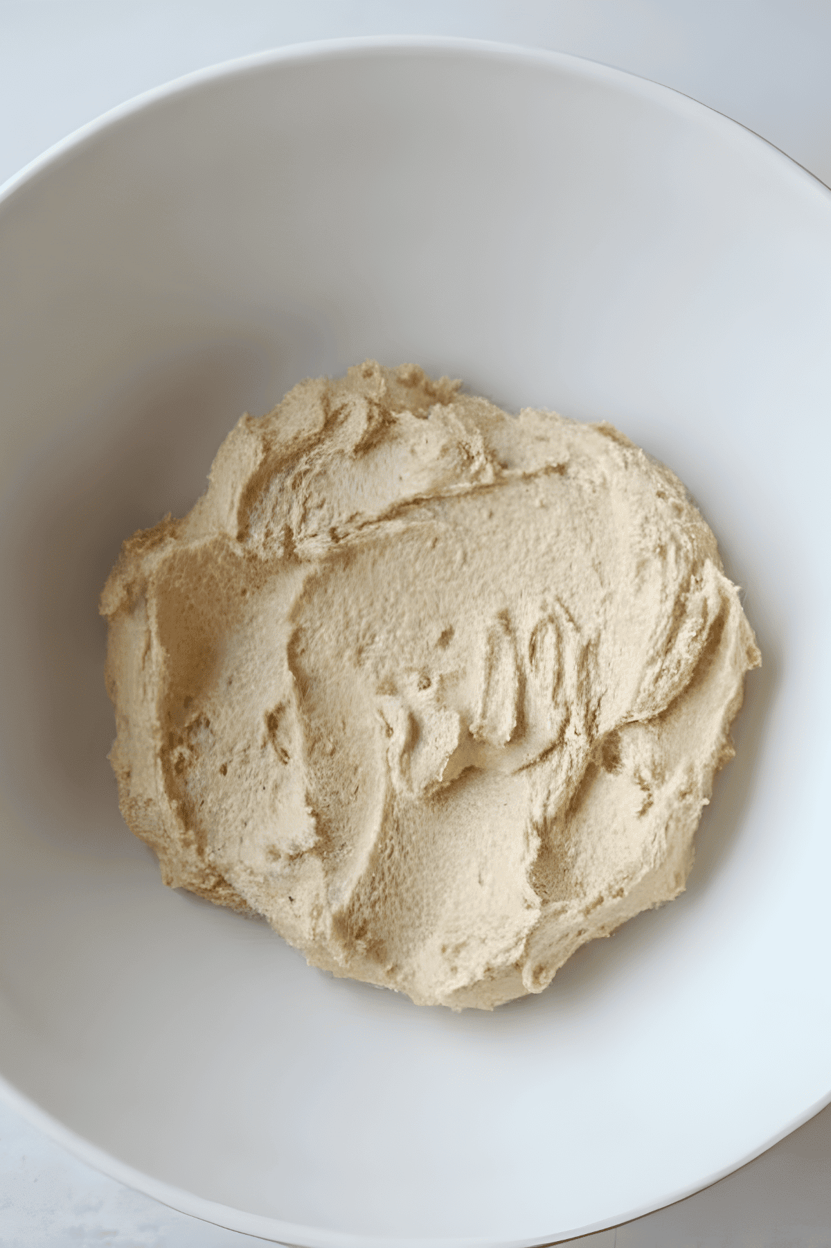 Cookie dough creamed in a white bowl