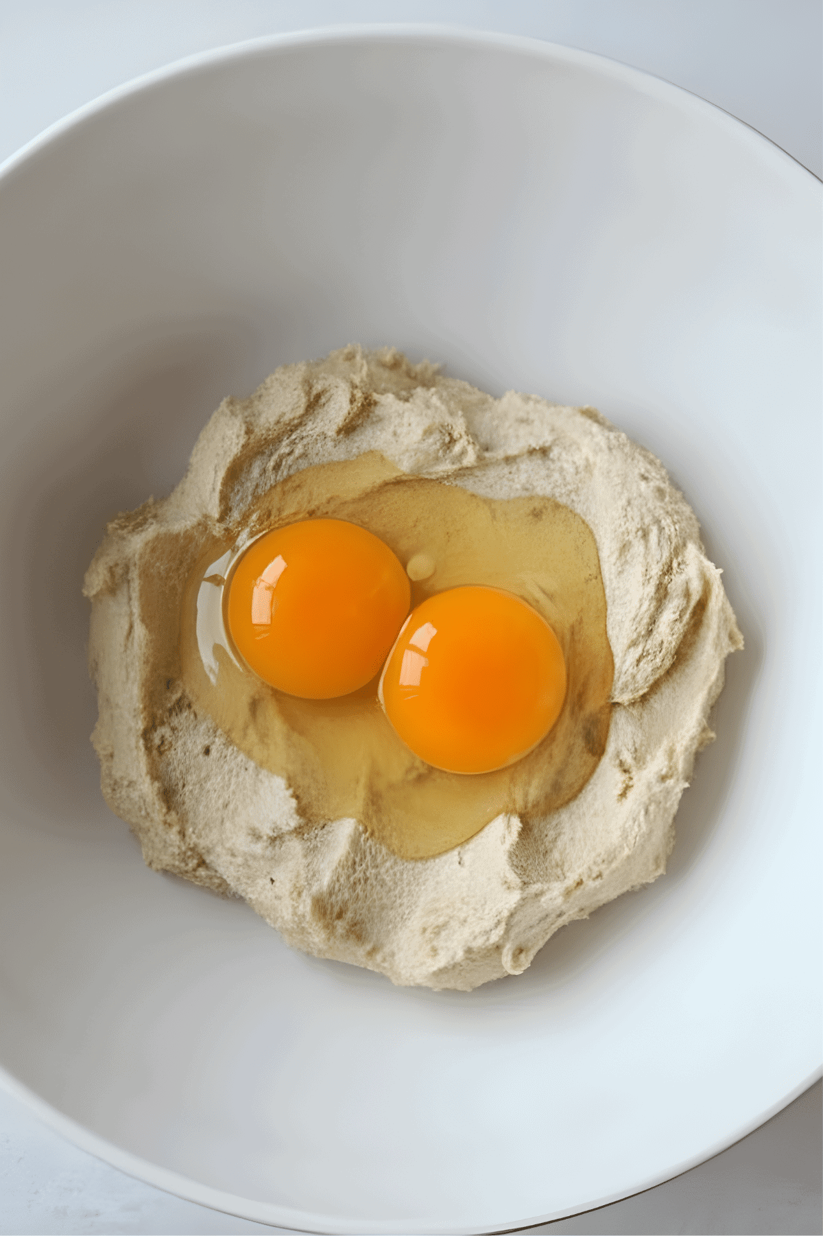 Two eggs on creamed cookie dough